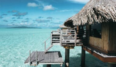 a building on stilts over water American express