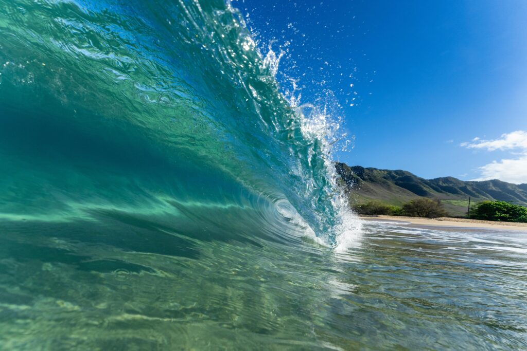 a wave crashing into the water Hainan Airlines