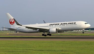 a white airplane taking off JAL boeing 737 order