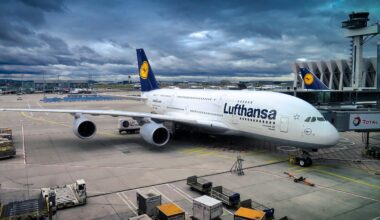 a large airplane parked at an airport aircraft supply