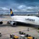 a large airplane parked at an airport aircraft supply