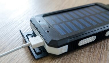 a solar cell phone with a white cable plugged into it Batteries power banks