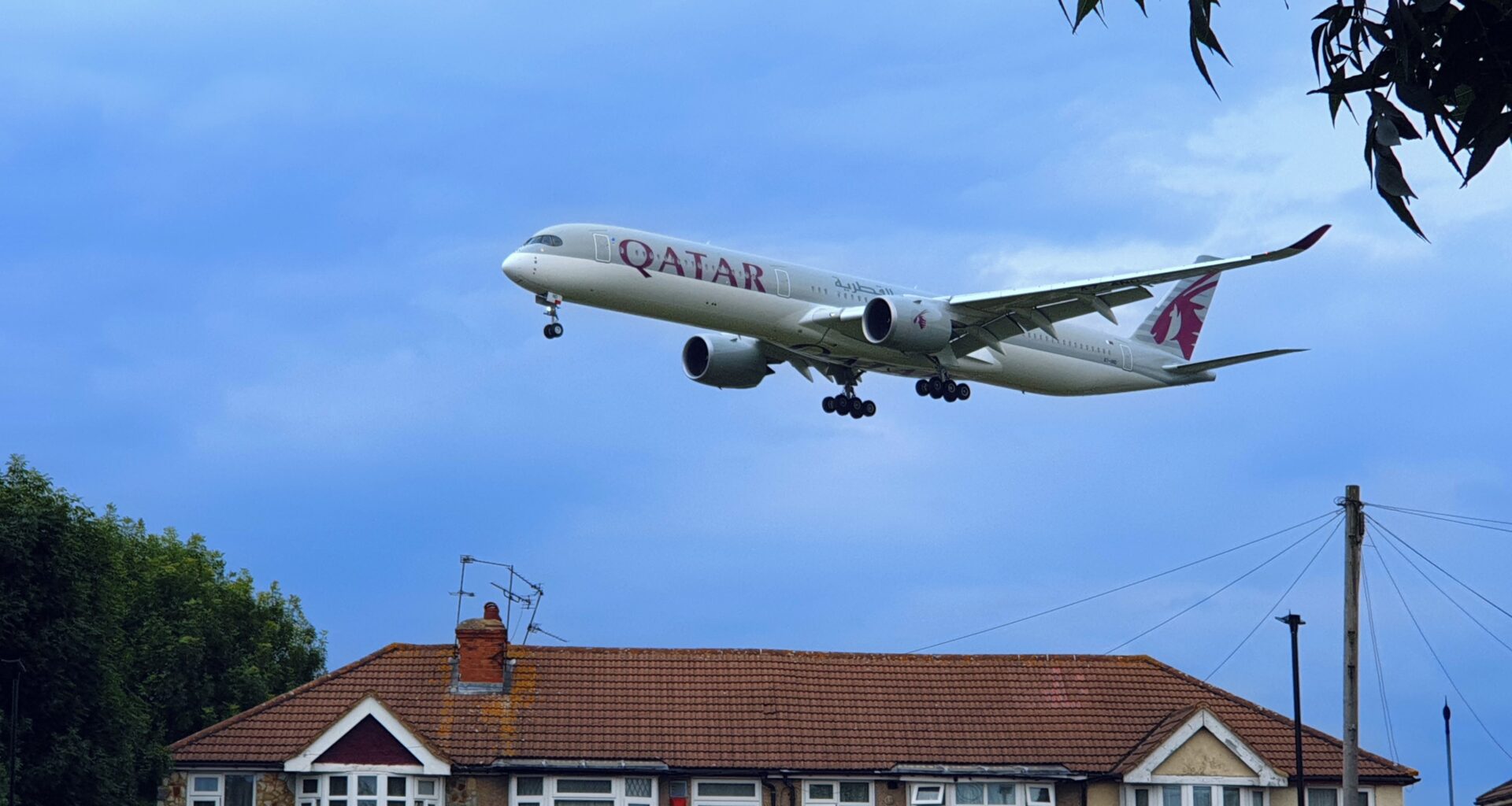 a plane flying in the sky Qatar