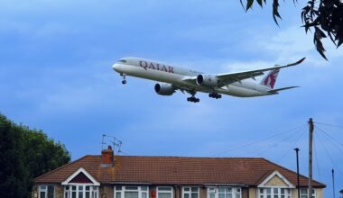 a plane flying in the sky Qatar