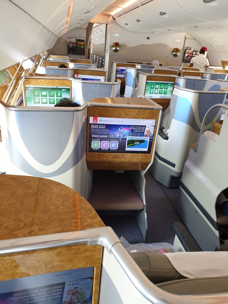 a plane with seats and tables airport architecture