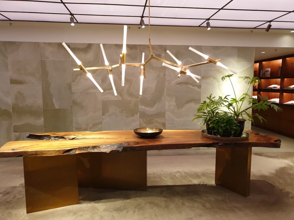 a chandelier from a wooden table airport architecture