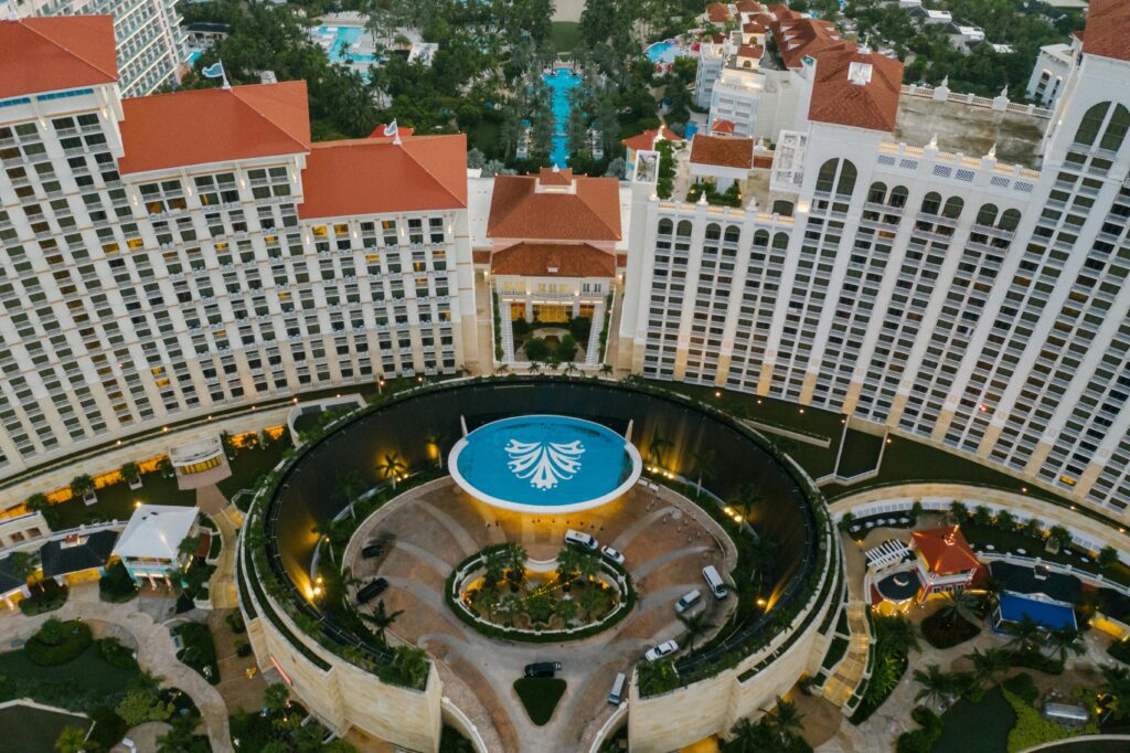 a large building with a pool and a pool in it World of Hyatt