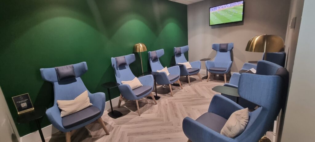 a room with chairs and a television