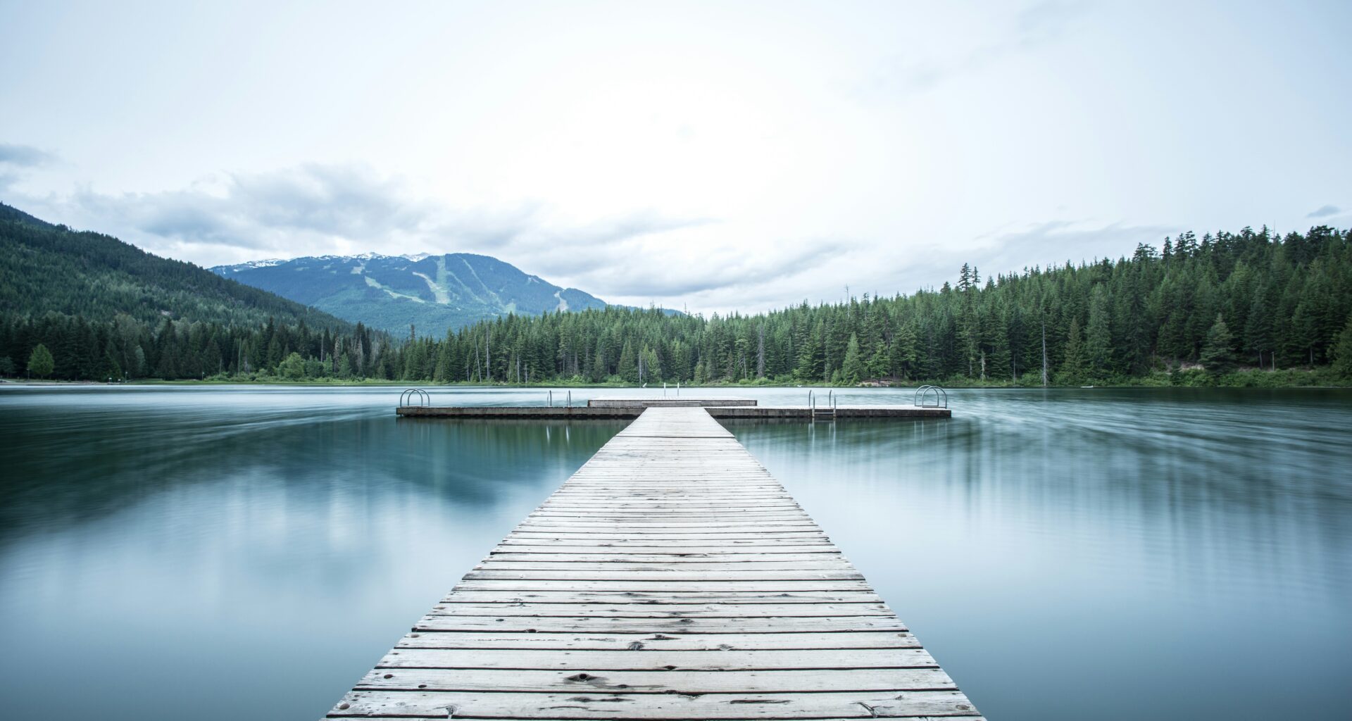 a dock leading to a lake BA Amex Business Card