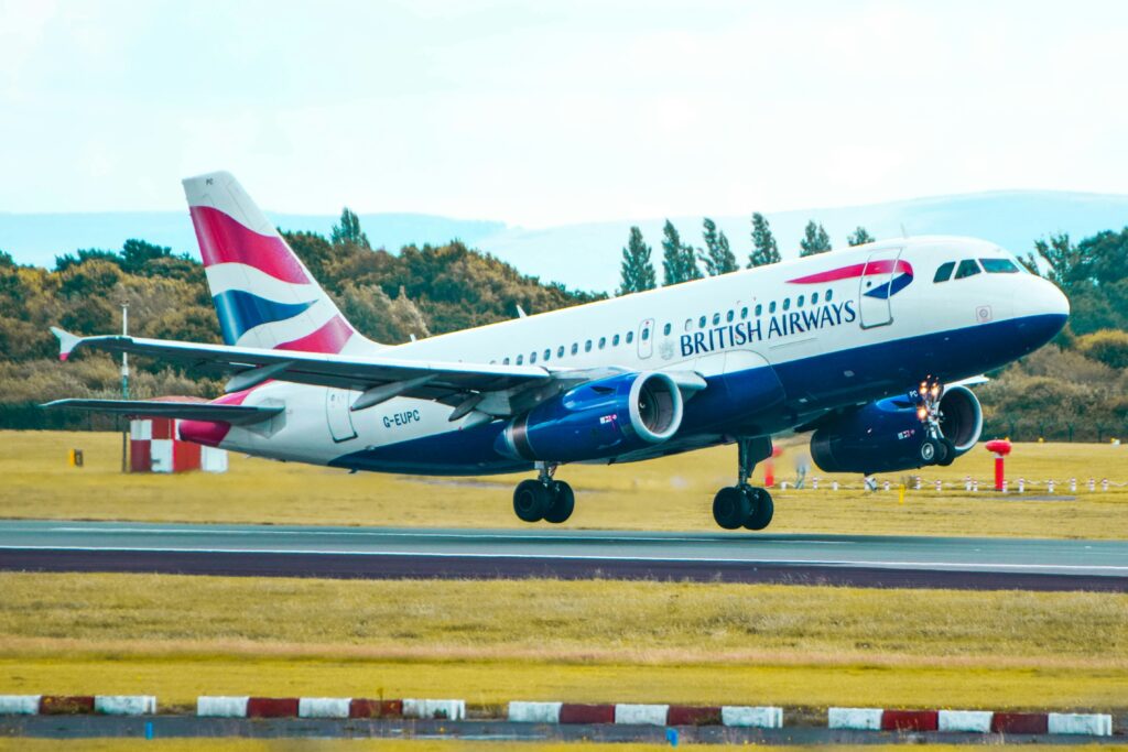 a plane taking off from a runway British Airways Club Guide