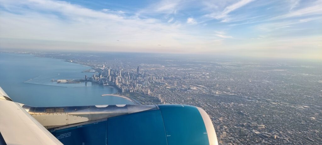 an airplane wing and a city