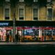 a building with a store front Five Guys Heathrow