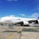 a large white airplane on a runway Global Airlines A380