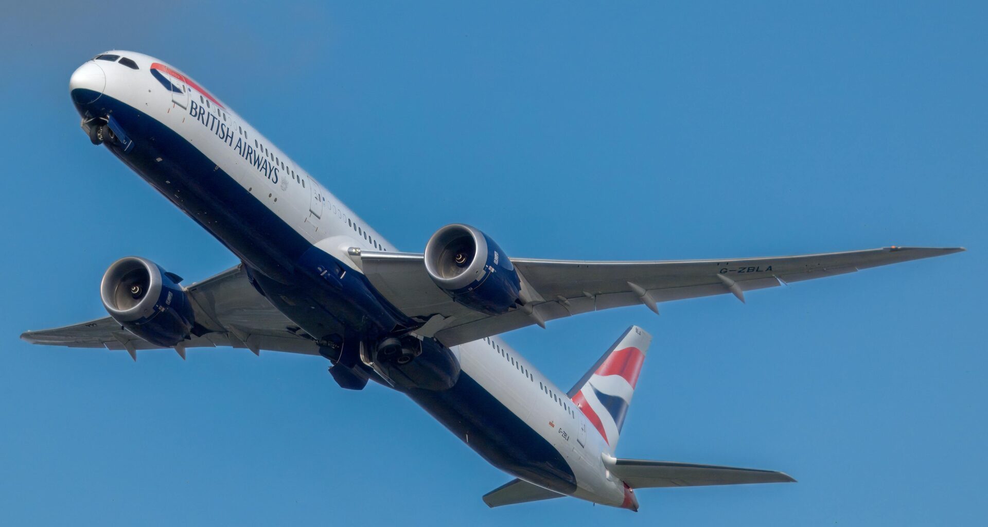 a plane flying in the sky IAG aircraft order 2025