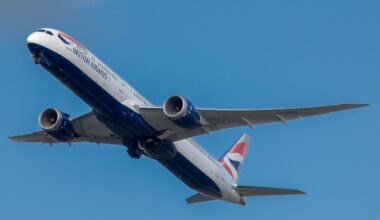 a plane flying in the sky IAG aircraft order 2025