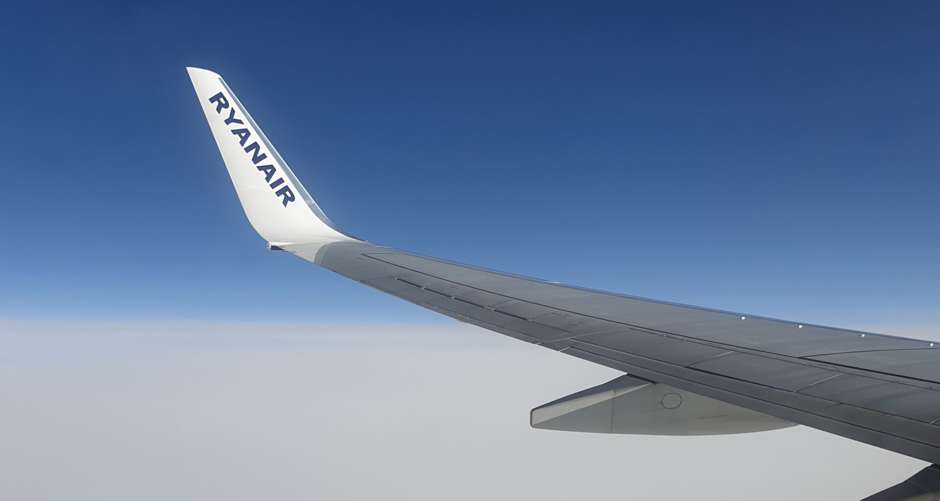 the wing of an airplane Ryanair Spirit easyJet