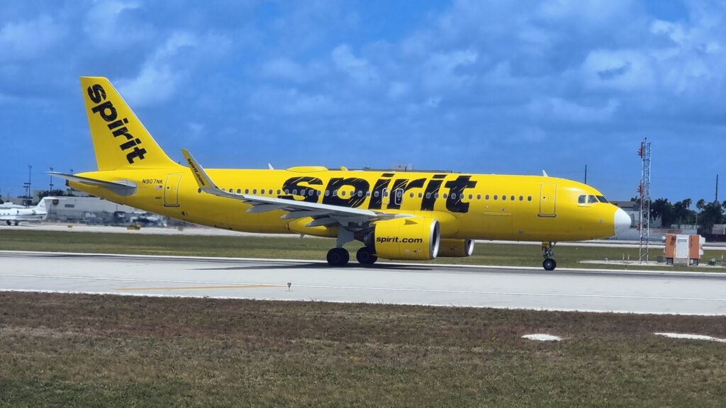 a yellow airplane on a runway Ryanair Spirit easyJet