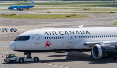 a white airplane on a runway Air Canada London India