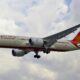 a plane flying in the sky Air India Flight AI171