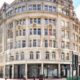 a building with many windows Travelodge Liverpool Street hotel