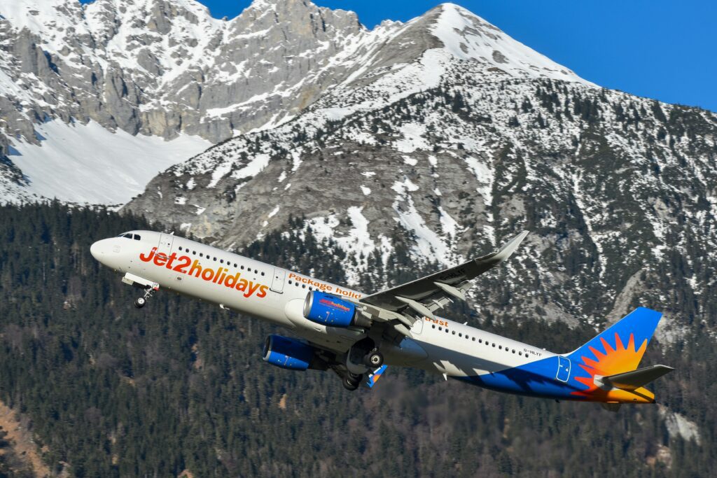 a plane flying over a mountain Nothing Beats a Jet2Holiday