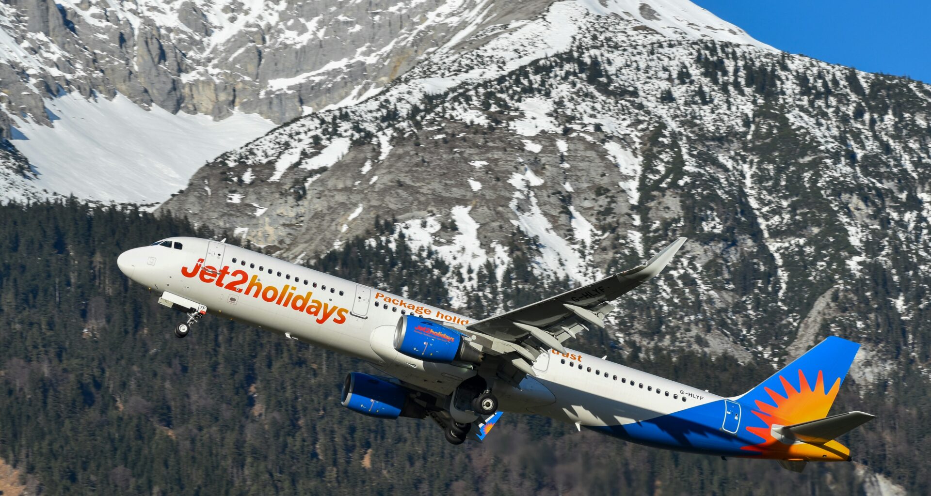 a plane flying over a mountain Nothing Beats a Jet2Holiday