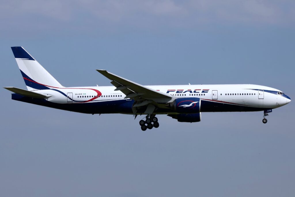 a plane flying in the sky Air Peace London