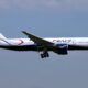 a plane flying in the sky Air Peace London