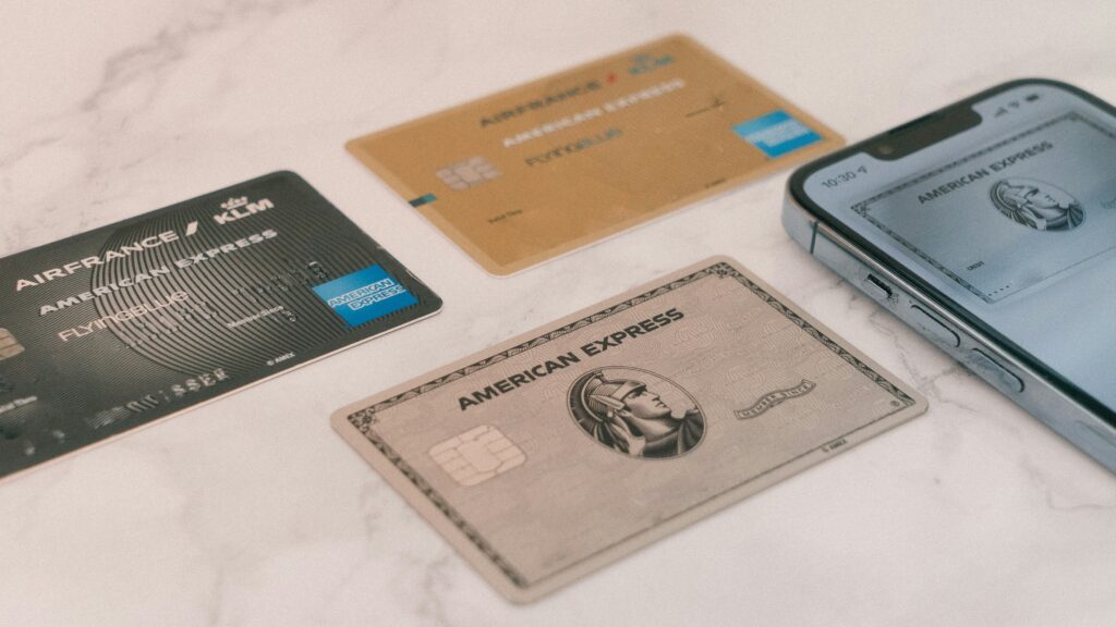 a group of credit cards and a cell phone Best UK credit card offers