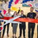 a group of people holding giant scissors Manchester Airport Terminal 2