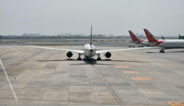 a plane on the runway premium flyer tax