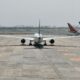a plane on the runway premium flyer tax