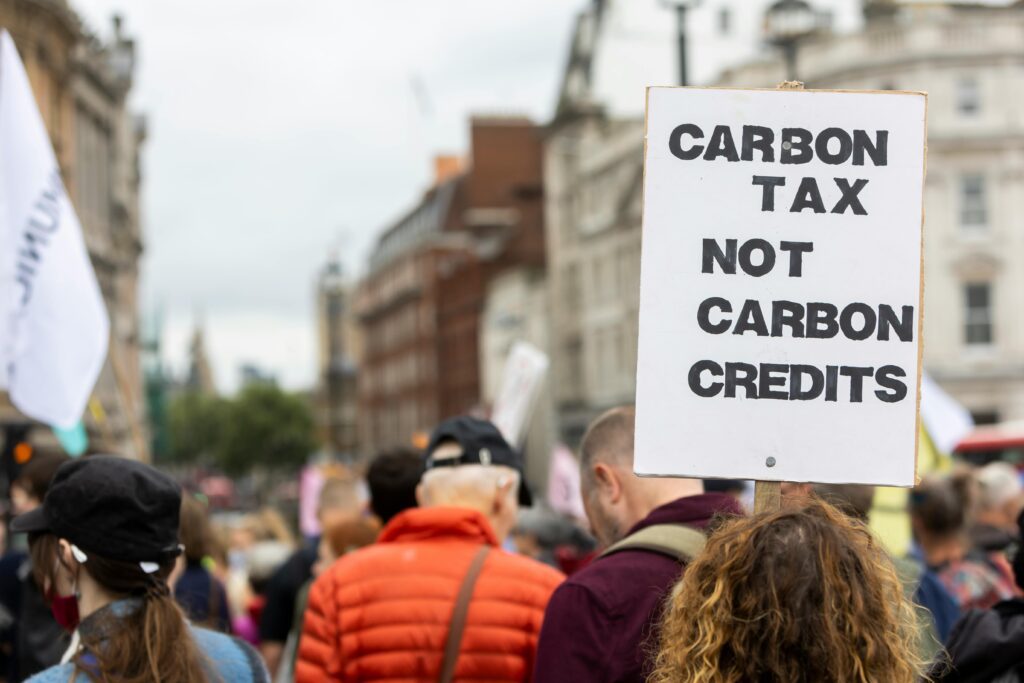a group of people holding signs premium flyer tax