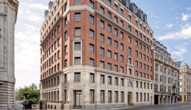 a large brick building with many windows The Derby London City