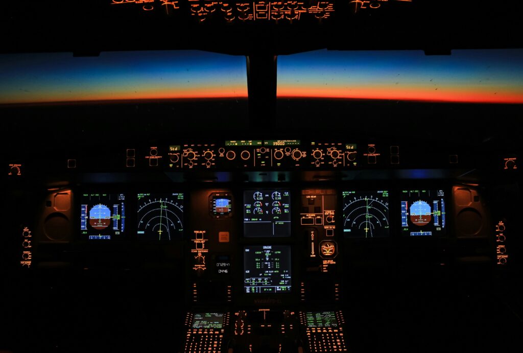 a cockpit of an airplane with a view of the sunset cameras in aircraft cockpits