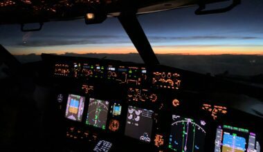 a cockpit of an airplane with many screens and a view of the sunset cameras in aircraft cockpits cameras on passenger aircraft