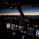 a cockpit of an airplane with many screens and a view of the sunset cameras in aircraft cockpits cameras on passenger aircraft