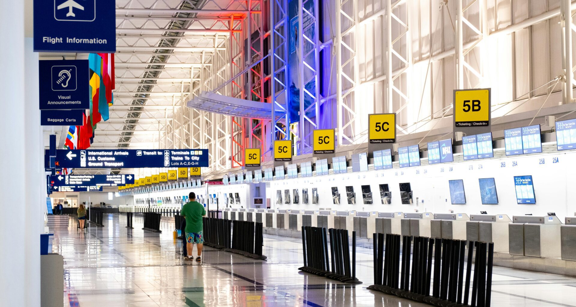 a man walking in a large airport British Airways compensation UK261