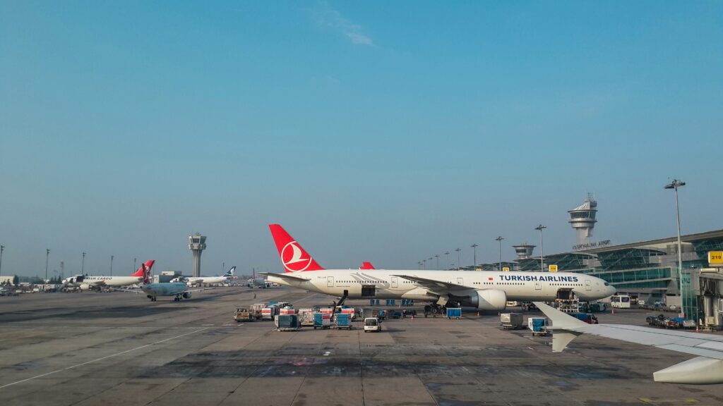 a large airplane parked on a runway Turkish Airlines Boeing order