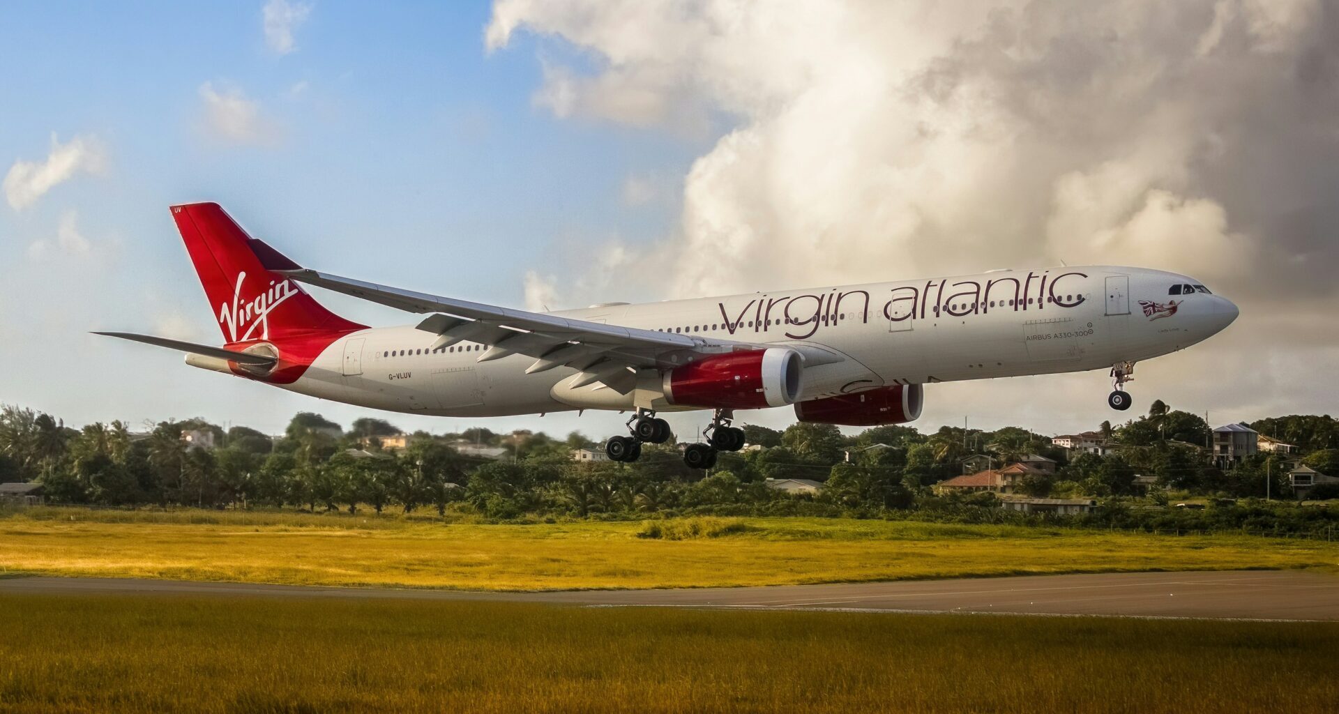 a plane taking off from a runway Virgin Atlantic Flying Club
