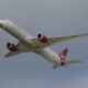 a plane flying in the sky Corneel Koster Virgin Atlantic