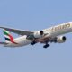 a large airplane flying in the sky United Airlines Glasgow Newark